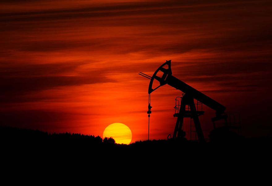 Oil well and red sky
