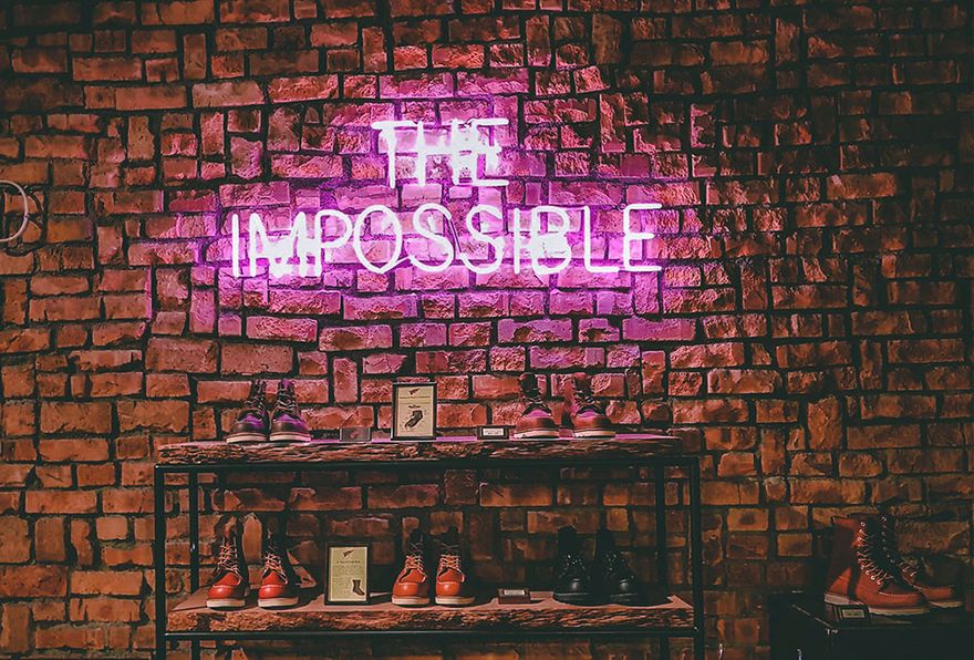 The impossible neon sign on brick wall